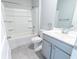 Bathroom with a tub and shower combination, complemented by a toilet and stylish vanity at 506 Hogwart Ln., Longs, SC 29568