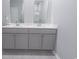 Bathroom featuring a double sink vanity with modern gray cabinets and two large mirrors at 506 Hogwart Ln., Longs, SC 29568