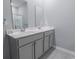 Bathroom with a double sink vanity, stylish fixtures, and ample counter space at 506 Hogwart Ln., Longs, SC 29568
