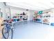 Spacious garage with epoxy flooring and ample shelving for organization and storage at 506 Hogwart Ln., Longs, SC 29568