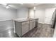 Open concept kitchen with a granite island, stainless steel appliances and wood flooring at 506 Hogwart Ln., Longs, SC 29568