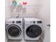 Laundry room featuring modern, front-load washing machine and dryer on gray tile at 506 Hogwart Ln., Longs, SC 29568