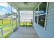 Relaxing screened porch with ceiling fan and views of the backyard at 506 Hogwart Ln., Longs, SC 29568