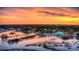 Waterfront aerial shot with a colorful sunset, showcasing the coastal charm at 5074 Cowart Ct., Murrells Inlet, SC 29576