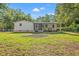 Expansive backyard with a covered patio, ideal for outdoor dining and entertaining in a serene setting at 5074 Cowart Ct., Murrells Inlet, SC 29576