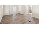 Spacious bedroom with hardwood floors and multiple doorways offering access to other rooms at 5074 Cowart Ct., Murrells Inlet, SC 29576