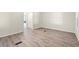 Bright bedroom boasts wood-look floors, white walls and trim, and access to the bathroom at 5074 Cowart Ct., Murrells Inlet, SC 29576