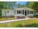 Charming single-story home with white siding, black shutters, and a well-manicured front yard at 5074 Cowart Ct., Murrells Inlet, SC 29576