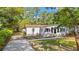 Charming home with manicured lawn and walkway leading to the front door, perfect for enjoying the outdoors at 5074 Cowart Ct., Murrells Inlet, SC 29576