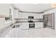 Modern kitchen featuring stainless steel appliances, granite countertops, and white cabinetry at 5074 Cowart Ct., Murrells Inlet, SC 29576