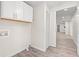 Functional laundry room features ample storage space and updated flooring at 5074 Cowart Ct., Murrells Inlet, SC 29576