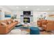 Staged living room with stone fireplace, complemented by contemporary furniture and warm, inviting decor at 5074 Cowart Ct., Murrells Inlet, SC 29576