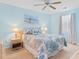 Inviting bedroom featuring a comfortable bed, nautical decor, and ample natural light at 556 White River Dr. # 44F, Myrtle Beach, SC 29579