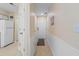 Hallway features neutral paint, wainscoting and tile floors at 556 White River Dr. # 44F, Myrtle Beach, SC 29579