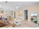 Inviting living room with a comfortable sofa, view of dining area, and entertainment center at 556 White River Dr. # 44F, Myrtle Beach, SC 29579