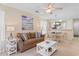 Cozy living room with comfortable seating, ceiling fan, and beach-themed decor at 556 White River Dr. # 44F, Myrtle Beach, SC 29579