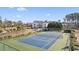 Aerial view of a community tennis court surrounded by lush greenery at 556 White River Dr. # 44F, Myrtle Beach, SC 29579