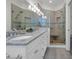 Beautiful bathroom featuring double vanity with granite countertop and glass enclosed shower with built in bench at 573 S Dunes Dr., Pawleys Island, SC 29585