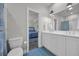 Bright bathroom with double sinks and a coastal color palette at 573 S Dunes Dr., Pawleys Island, SC 29585