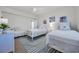 Shared bedroom features neutral coastal decor and striped rug at 573 S Dunes Dr., Pawleys Island, SC 29585