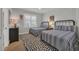 Bedroom featuring two twin beds, striped bedding, and closet storage at 573 S Dunes Dr., Pawleys Island, SC 29585