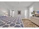 Bright bedroom with stylish decor, boho rug, and white-painted furniture at 573 S Dunes Dr., Pawleys Island, SC 29585