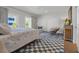 Neutral bedroom features a balcony, boho rug, and closet storage at 573 S Dunes Dr., Pawleys Island, SC 29585