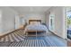 Bright bedroom featuring a balcony, bench, and coastal decor at 573 S Dunes Dr., Pawleys Island, SC 29585