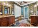 Well-appointed bathroom with dual vanities, patterned wallpaper, and tiled floors at 58 Swan Point Trail, Georgetown, SC 29440