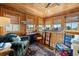 Cozy bonus room with wood paneling, built-in daybed, and multiple windows offering scenic views at 58 Swan Point Trail, Georgetown, SC 29440