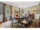 Formal dining room with decorative wallpaper, elegant chandelier, and ample natural light at 58 Swan Point Trail, Georgetown, SC 29440