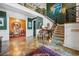 Elegant foyer with high ceilings, piano, patterned staircase runner, and an open view to another room at 58 Swan Point Trail, Georgetown, SC 29440