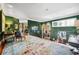 Upstairs hallway with hardwood floors, area rug, and views into adjacent rooms at 58 Swan Point Trail, Georgetown, SC 29440