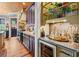 Elegant kitchen with custom cabinetry, stone countertops, and a wine refrigerator at 58 Swan Point Trail, Georgetown, SC 29440