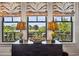 Sitting area with large windows offering views of trees and a waterway at 58 Swan Point Trail, Georgetown, SC 29440