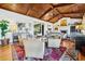Spacious living room with vaulted ceilings, wood floors, fireplace, and ample seating at 58 Swan Point Trail, Georgetown, SC 29440