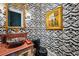 Unique powder room featuring patterned wallpaper, a decorative sink, and gold-framed mirror at 58 Swan Point Trail, Georgetown, SC 29440