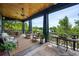 Outdoor screened porch with serene views, ceiling fans and comfortable seating at 58 Swan Point Trail, Georgetown, SC 29440