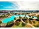 Aerial view of a resort-style pool, marina, and landscaped grounds in a vibrant community at 6095 Catalina Dr. # 714, North Myrtle Beach, SC 29582