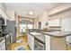 Well-lit kitchen features stainless appliances, ample counter space, and a cozy breakfast nook near a bright window at 6095 Catalina Dr. # 714, North Myrtle Beach, SC 29582
