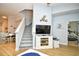 Open living space with stairs, coastal accents, wood flooring, and a partial view into the adjacent bedroom at 6095 Catalina Dr. # 714, North Myrtle Beach, SC 29582