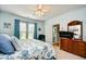 Inviting main bedroom features a plush bed, a dresser with a TV, and an ensuite bathroom for added convenience at 6095 Catalina Dr. # 714, North Myrtle Beach, SC 29582