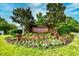 Well maintained entrance to Tanglewood community surrounded by flowerbeds and lush green foliage at 6095 Catalina Dr. # 714, North Myrtle Beach, SC 29582