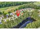 Scenic aerial view of a residential area bordering a serene lake and golf course at 6434 Longwood Dr., Murrells Inlet, SC 29576