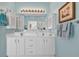 Bright and elegant bathroom showcasing double sinks and plenty of storage at 6434 Longwood Dr., Murrells Inlet, SC 29576