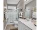 Well-maintained bathroom featuring a glass shower, a white vanity, and tile flooring at 6434 Longwood Dr., Murrells Inlet, SC 29576