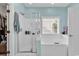 Bathroom featuring a separate shower, soaking tub, and view to backyard at 6434 Longwood Dr., Murrells Inlet, SC 29576
