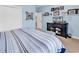 Comfortable bedroom with blue walls, a striped bedspread, and modern decor creating a calming retreat at 6434 Longwood Dr., Murrells Inlet, SC 29576