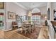 Elegant dining room with chandelier, large window and an area rug at 6434 Longwood Dr., Murrells Inlet, SC 29576