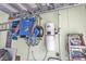 Well-organized garage featuring storage solutions, including wall-mounted racks and shelving at 6434 Longwood Dr., Murrells Inlet, SC 29576